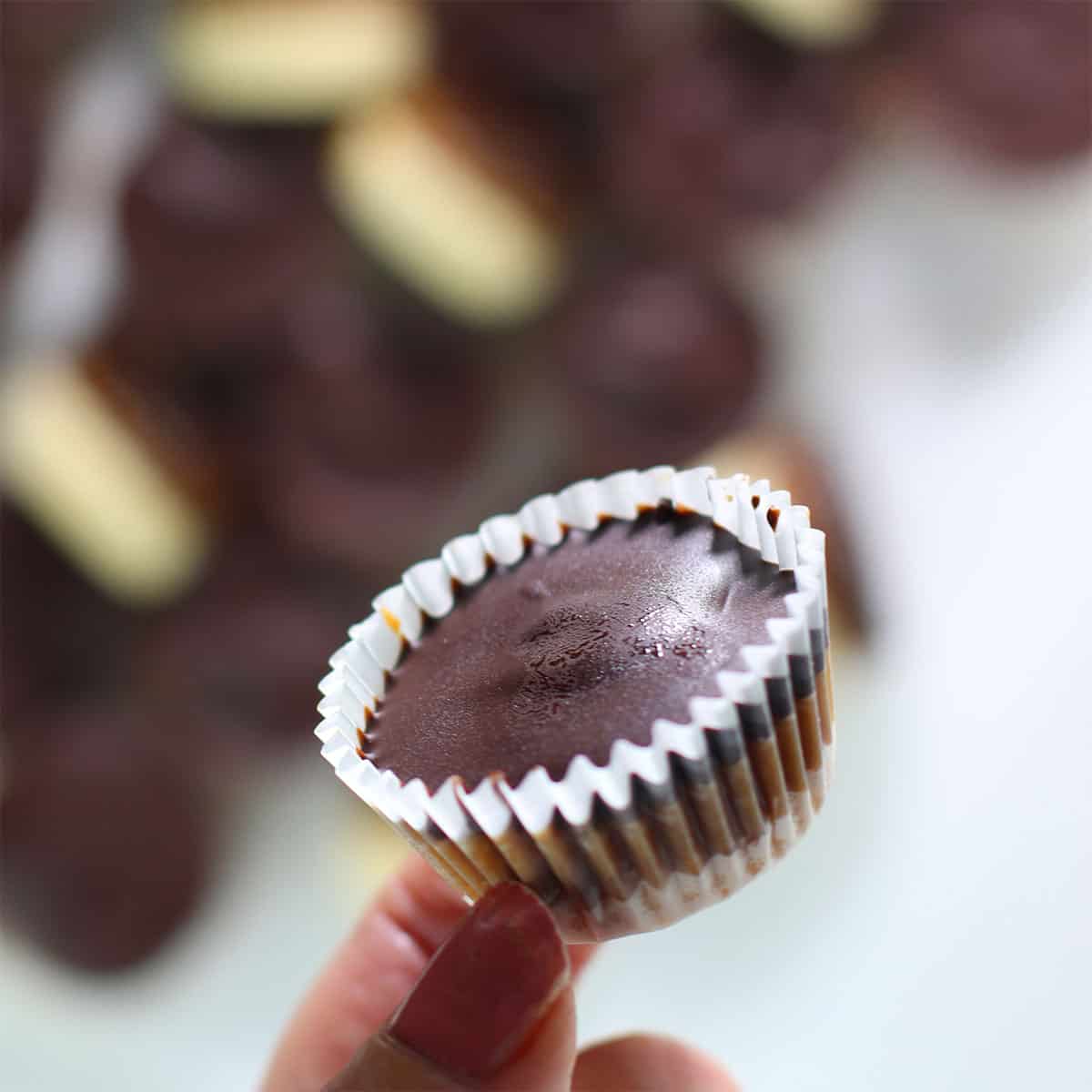 twix cups or bites held by hand.