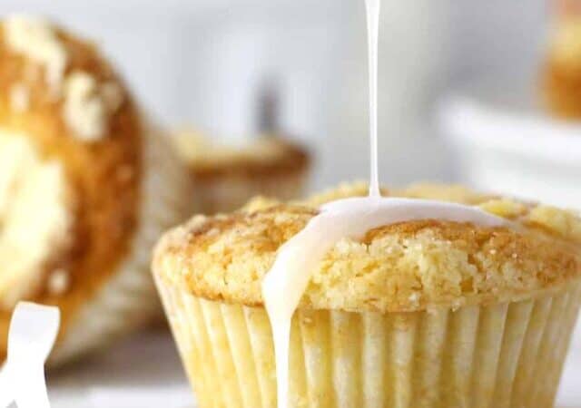 baked cranberry orange muffins on a dish.