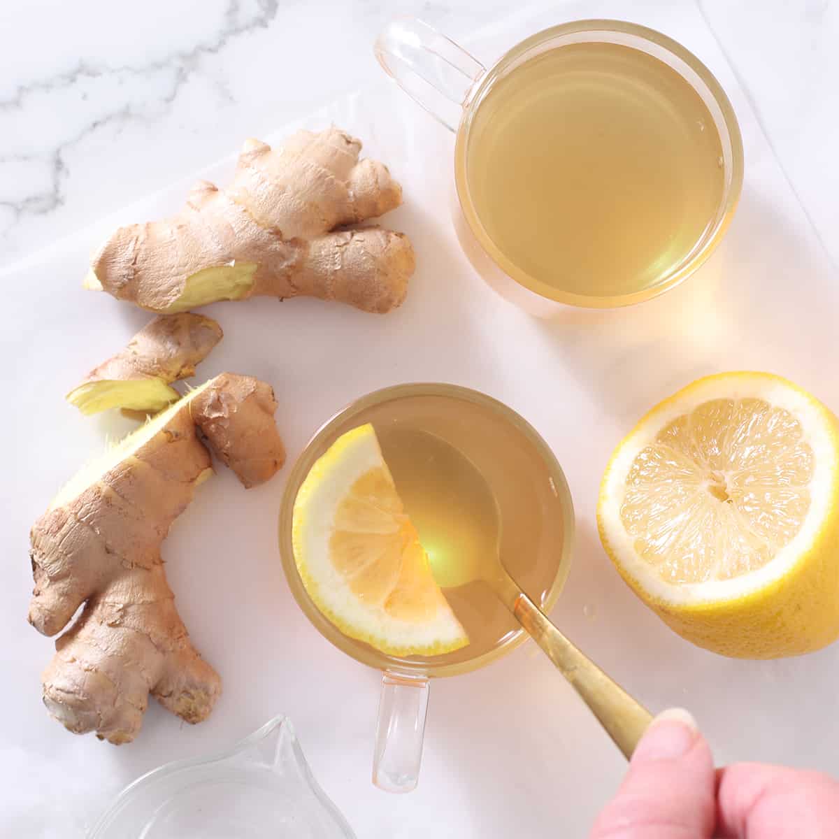 overhead shot of ginger tea with ginger and lemon