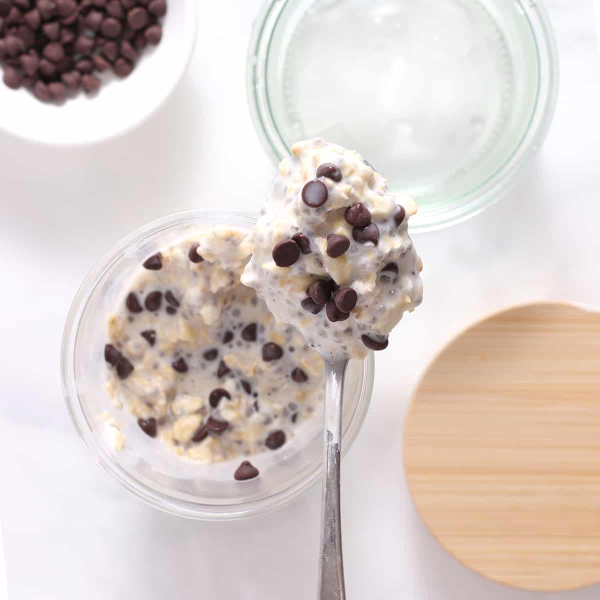 chocolate chip overnight oats in a spoon over a bowl