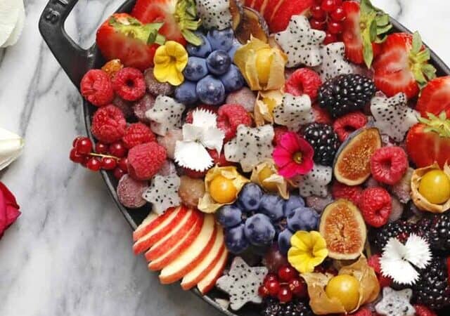 a fruit platter in an iron cast pan