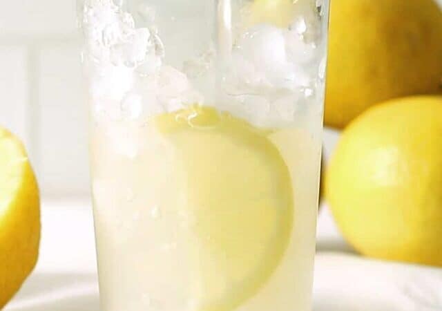 pouring lemonade over ice