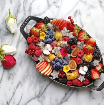 a fruit platter in an iron cast pan