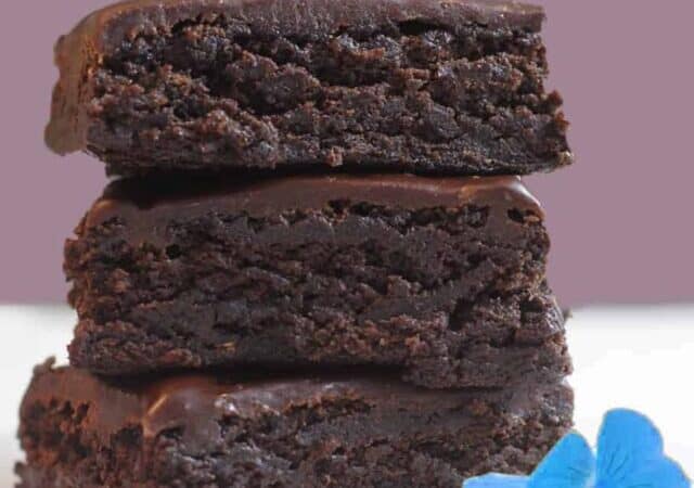 three brownies with pink background and blue flower.