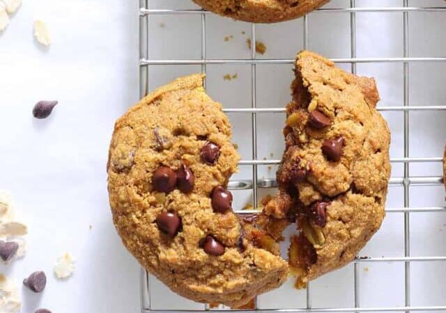 pumpkin cookies overhead shot with chocolate chips and oats on counter.