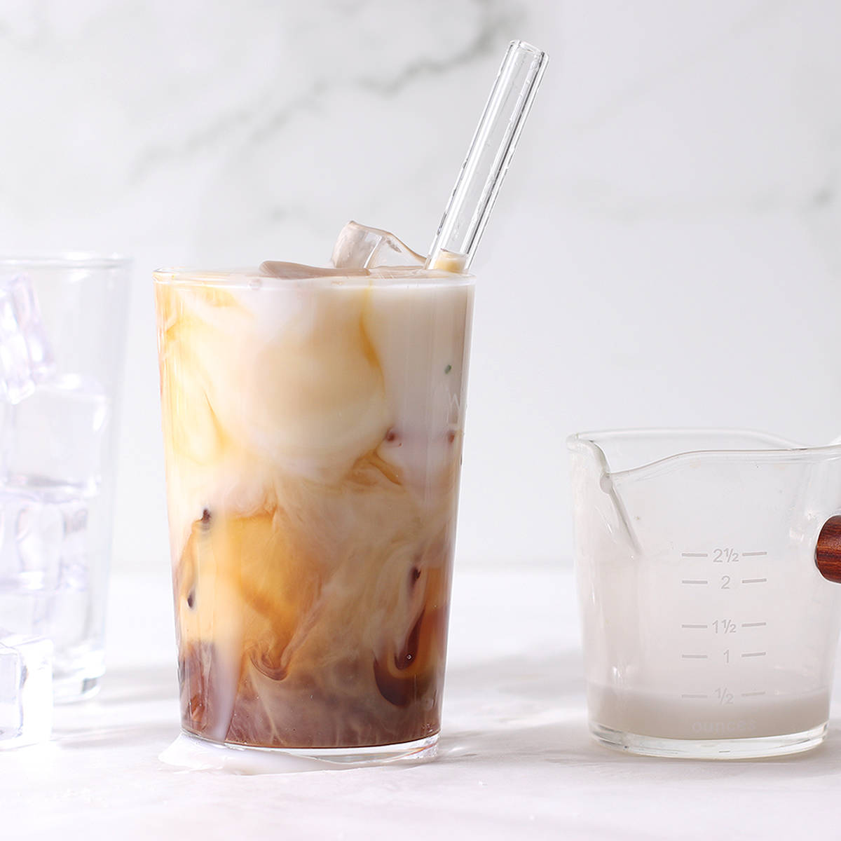 homemade iced coffee in a glass with a straw.