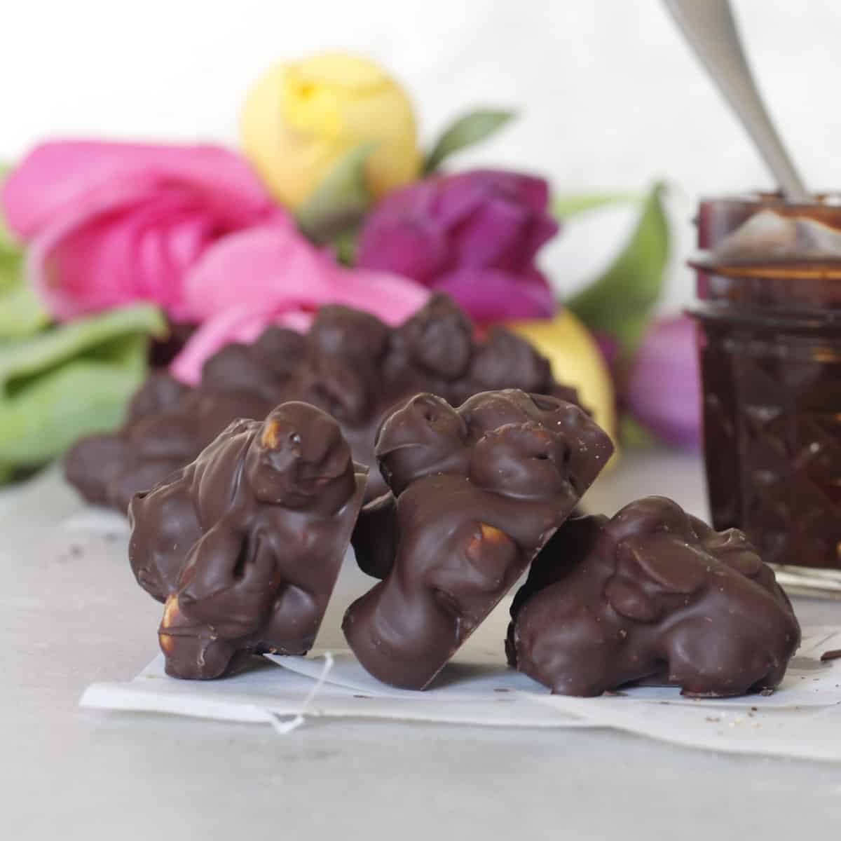 three chocolate covered chickpeas in a row.
