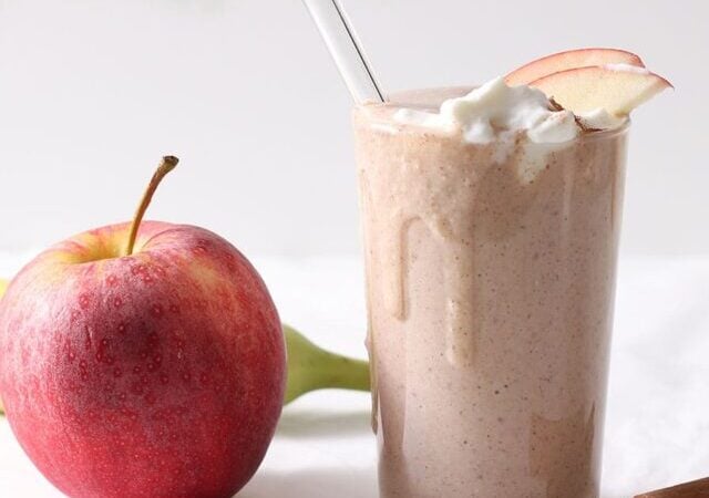 apple banana smoothie in a glass.