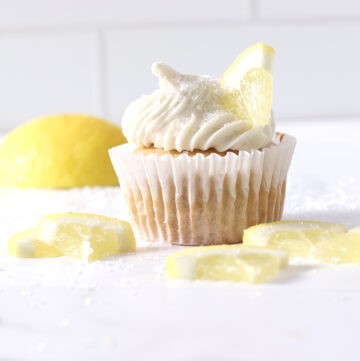 lemon cupcake on a white board for foods that are yellow.