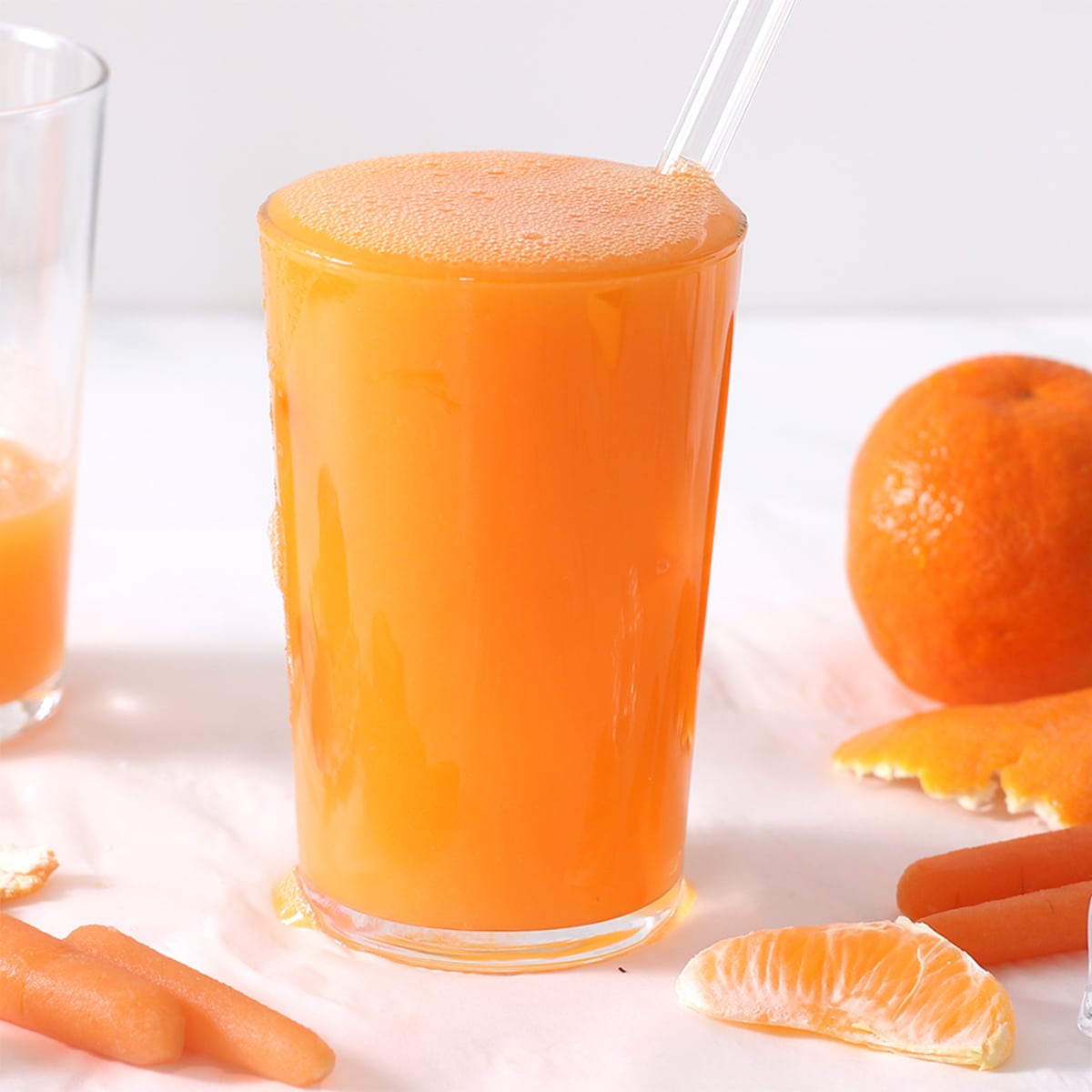 a glass of carrot ginger juice.