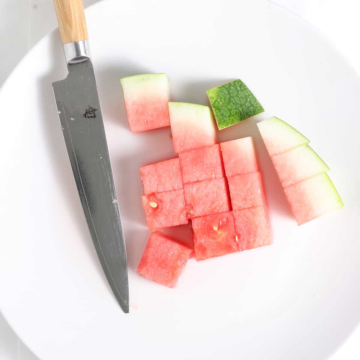 cut watermelon chopped on a dish.