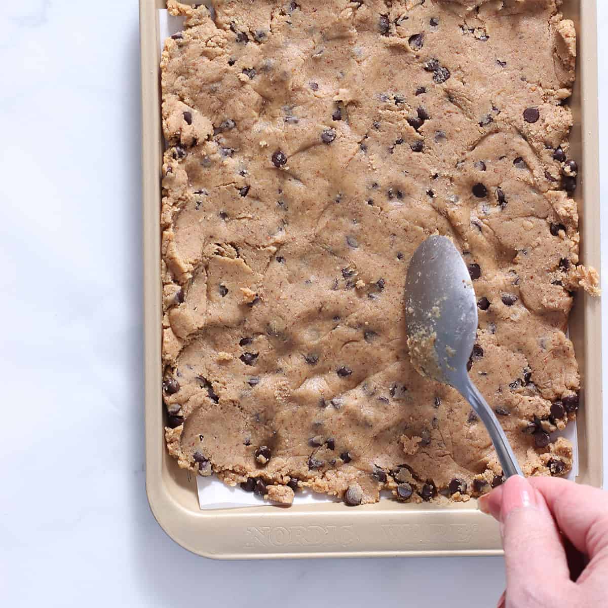 cookie dough chunk batter pressed into pan.