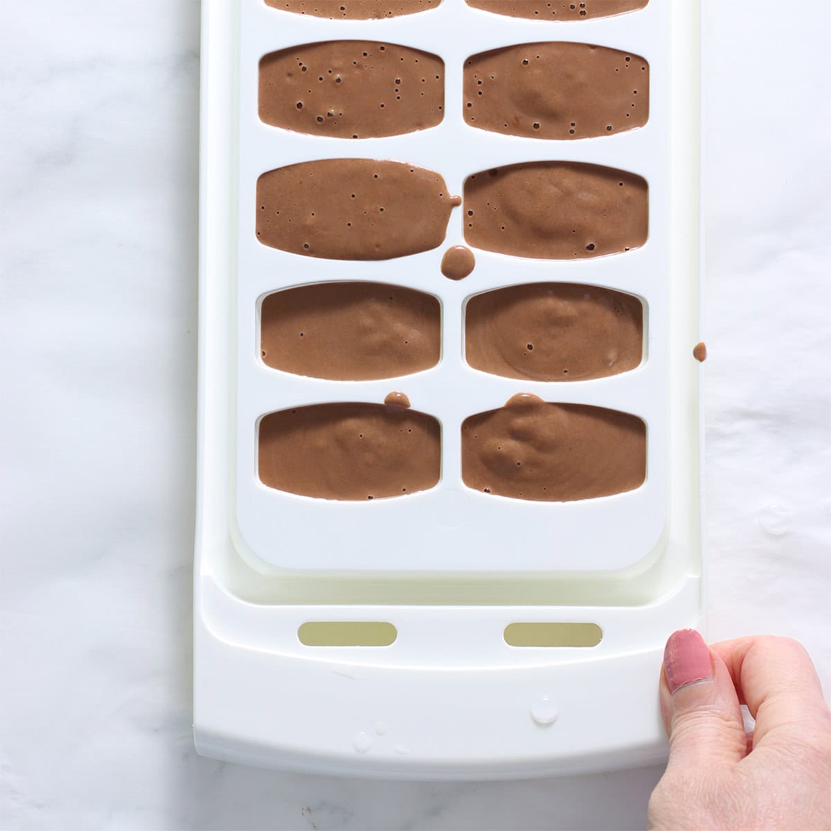 oreo ice cream blended and in ice cube trays.