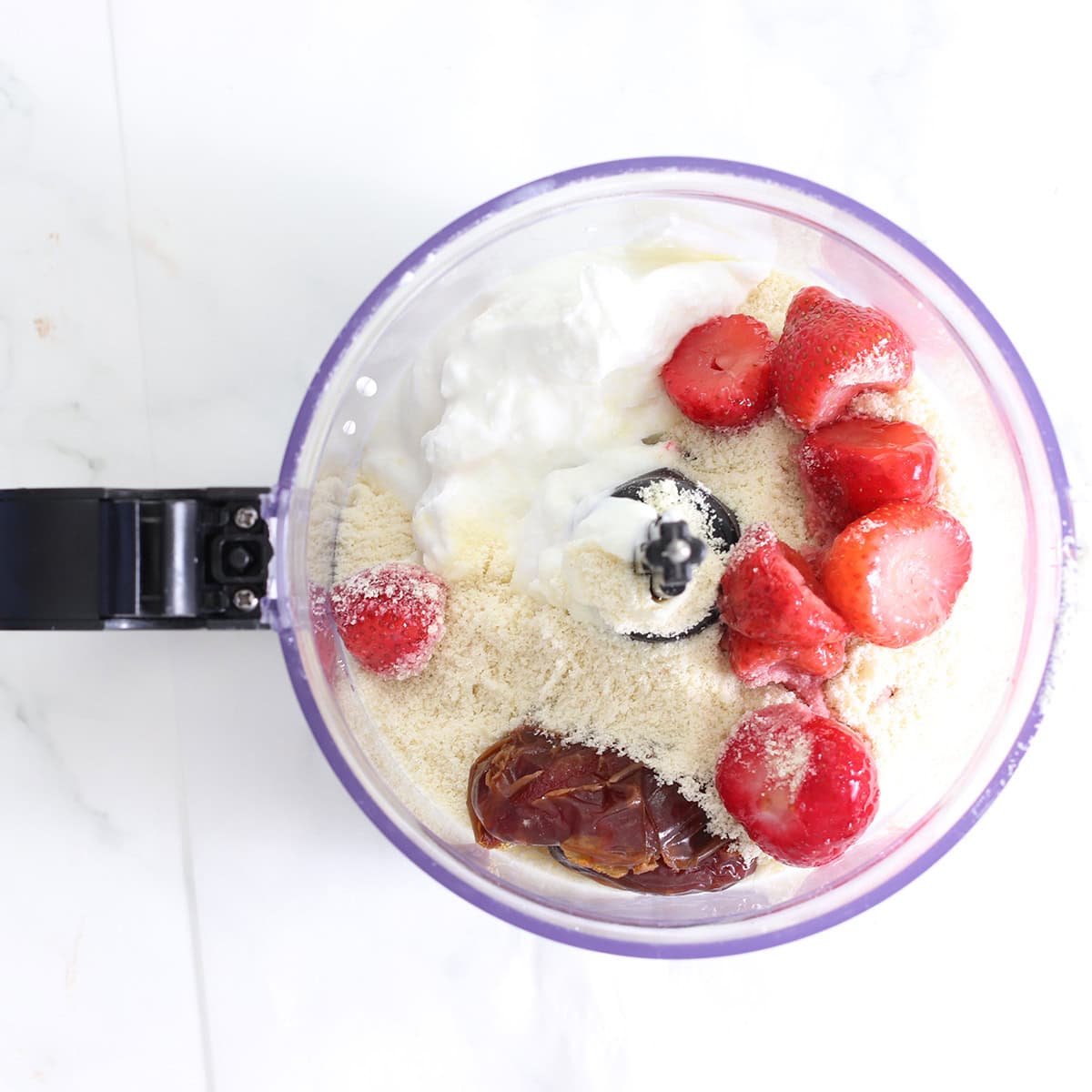 strawberry frozen yogurt cookie dough ingredients in a food processor.