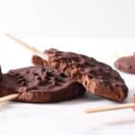 chocolate frozen yogurt pops on a pile.