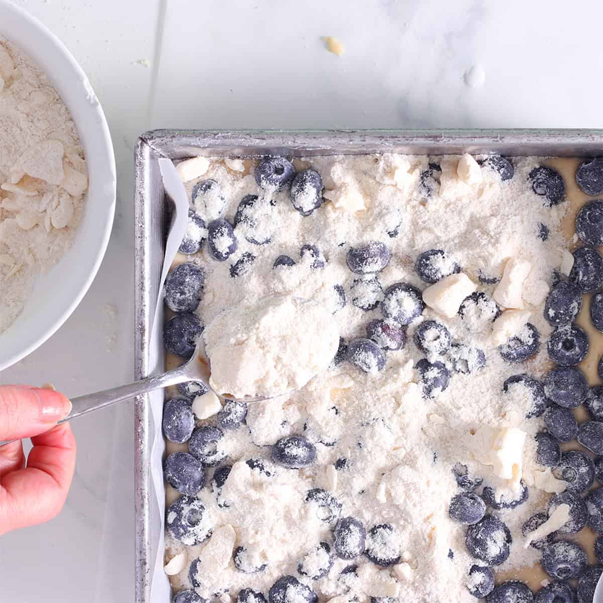 lemon blueberry crumb cake berries on top.