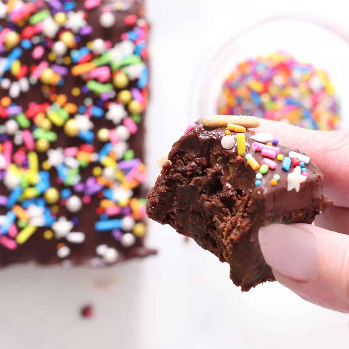 chickpea brownies with a bite and sprinkles.