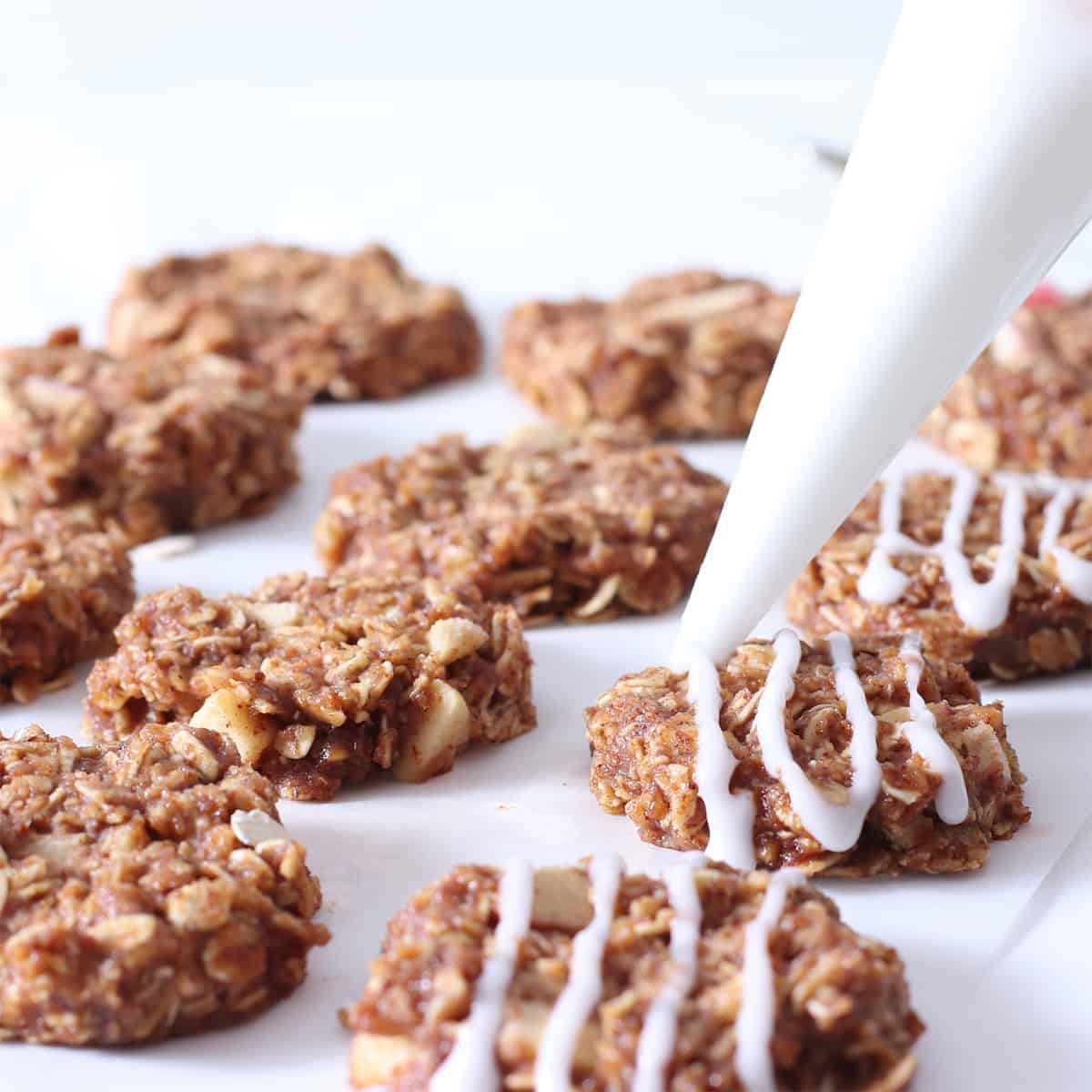 icing drizzled on no bake apple spice cookies.