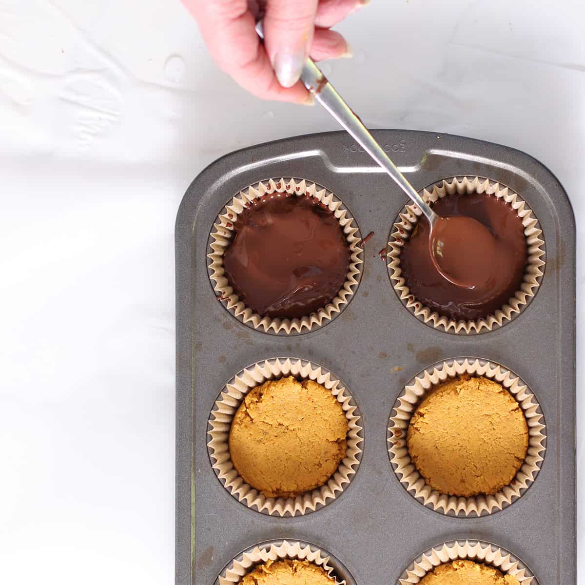 pumpkin peanut butter cups with chocolate top.