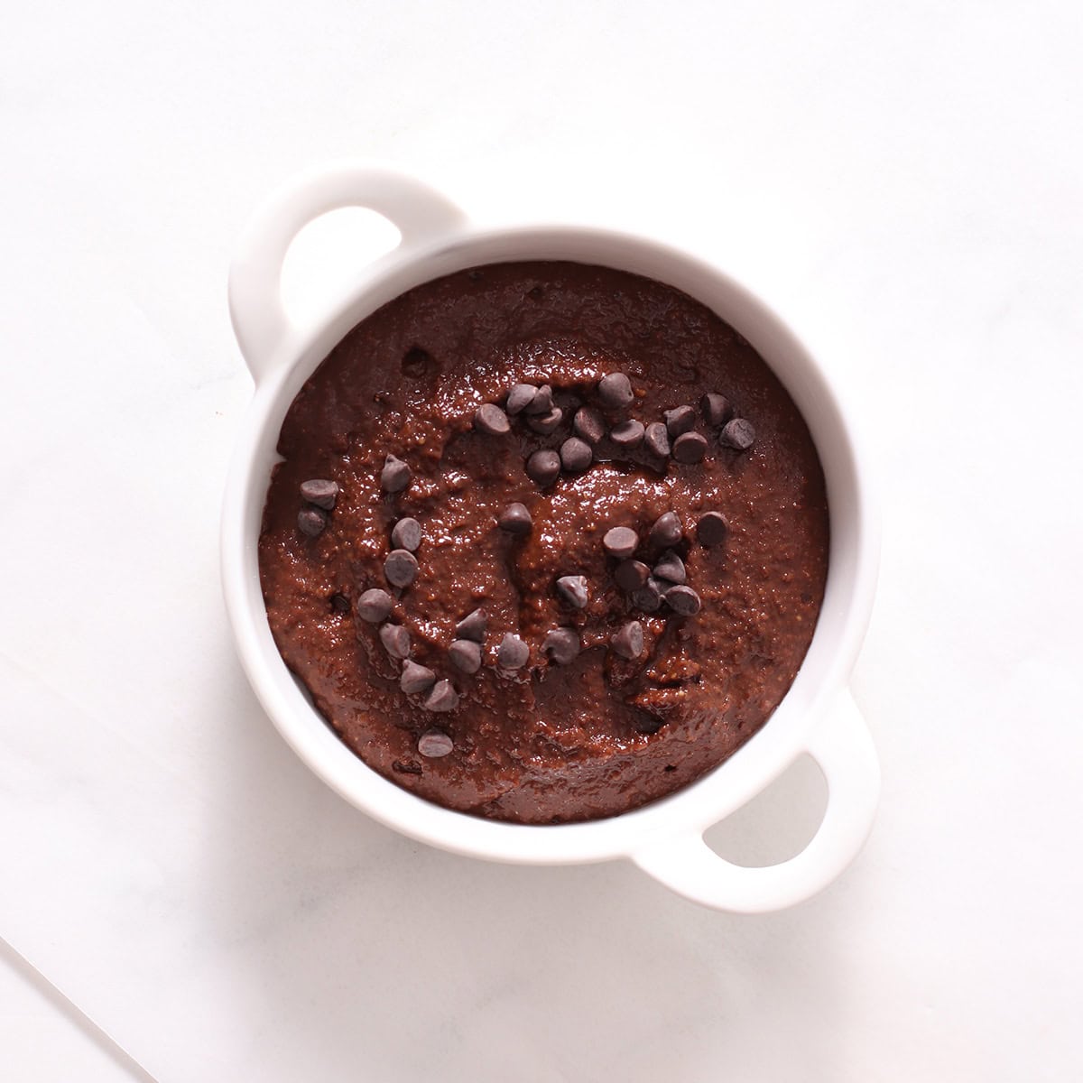 single serve brownie with almond flour in a mug in a ramikin.