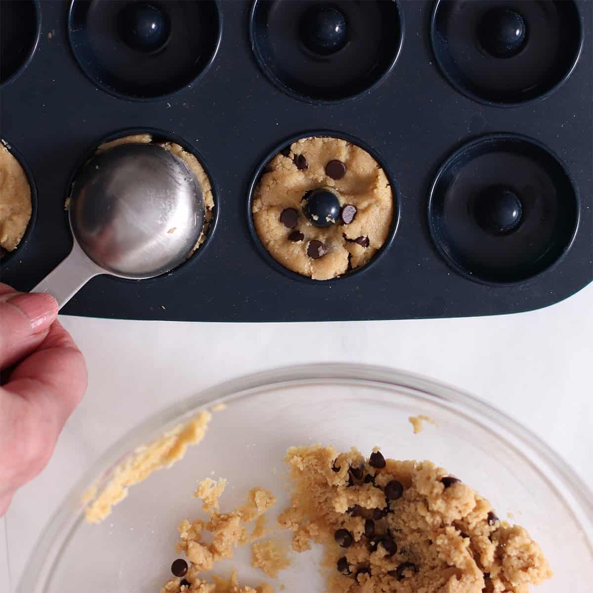 no bake cookie dough donuts pressed into a mold.