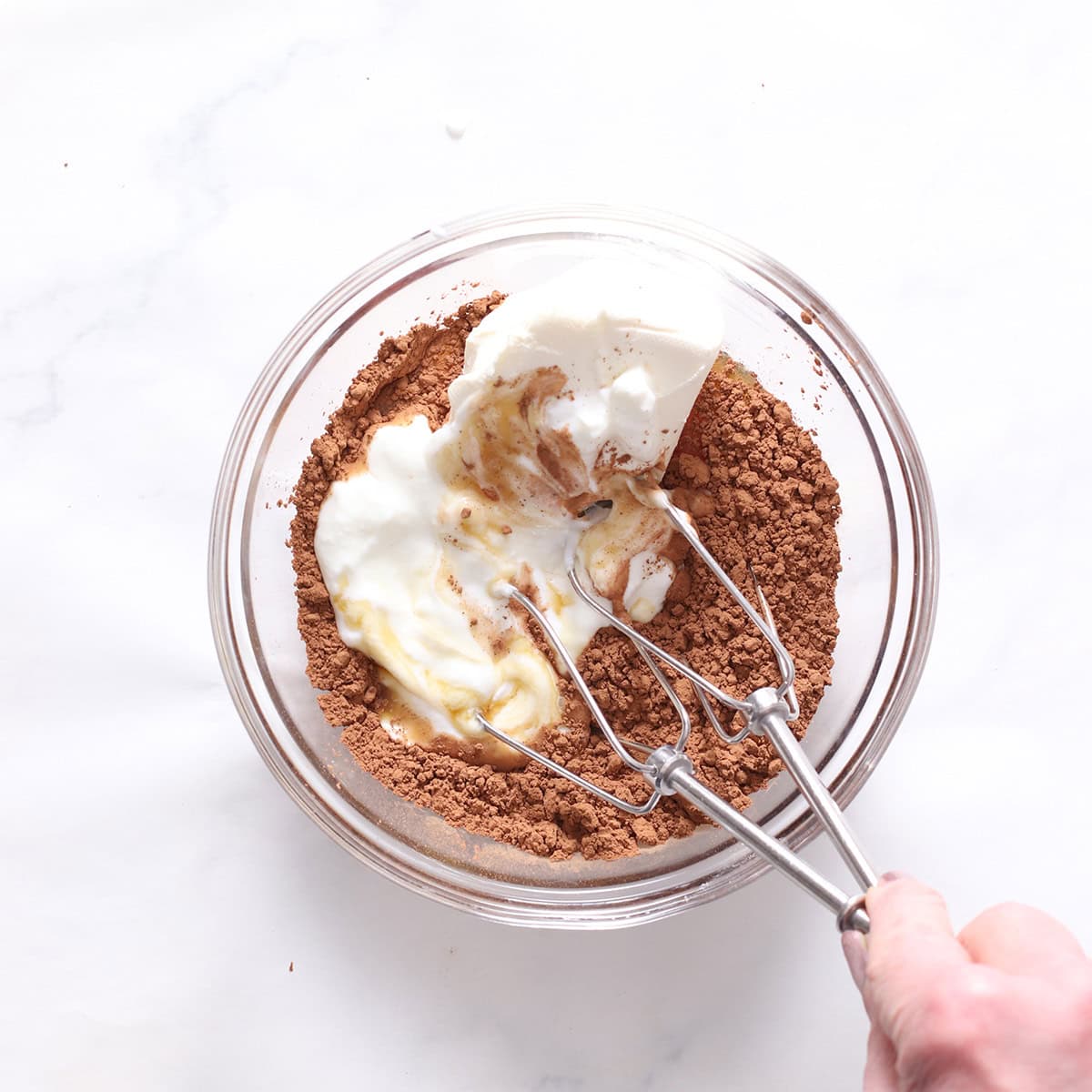 chocolate cheesecake bar filling ingredients in a bowl.