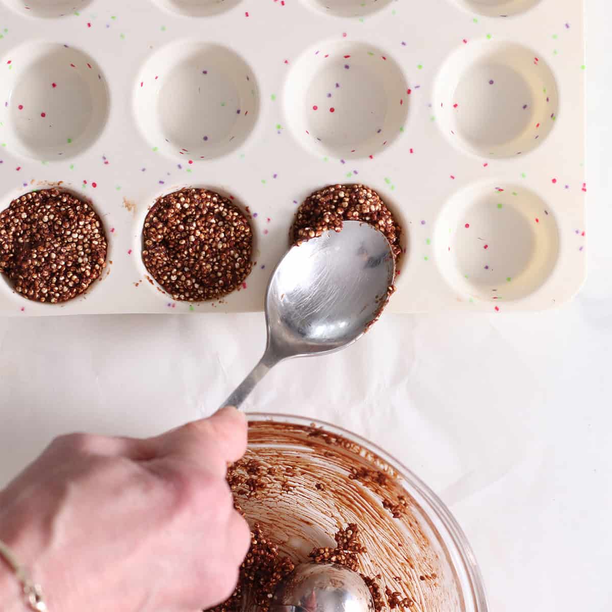 chocolate quinoa crisps in a mold.