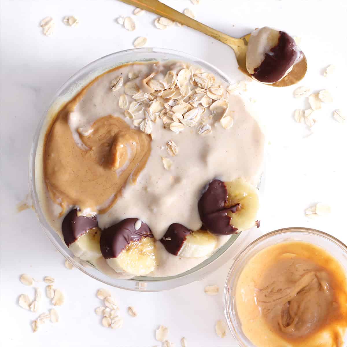 protein banana smoothie bowl with chocolate coated banana slices.