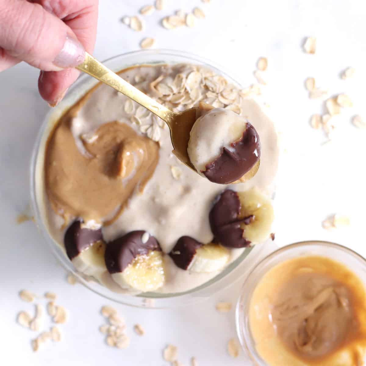 protein banana smoothie bowl with chocolate coated banana slices.