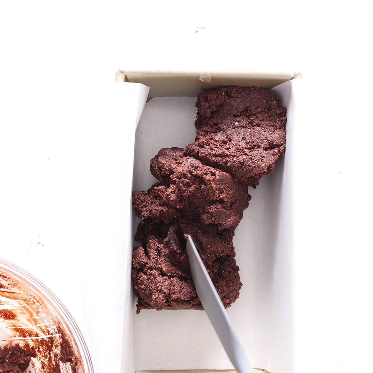 peanut butter stuffed brownie batter in a loaf pan.