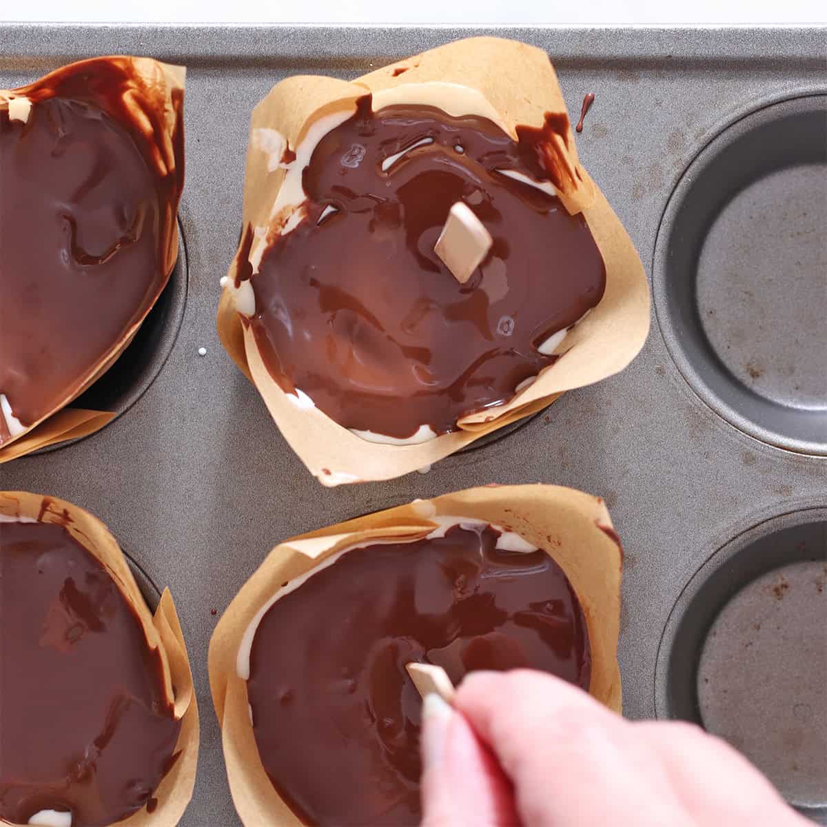 Pour magic shell on top of ice cream and insert sticks.