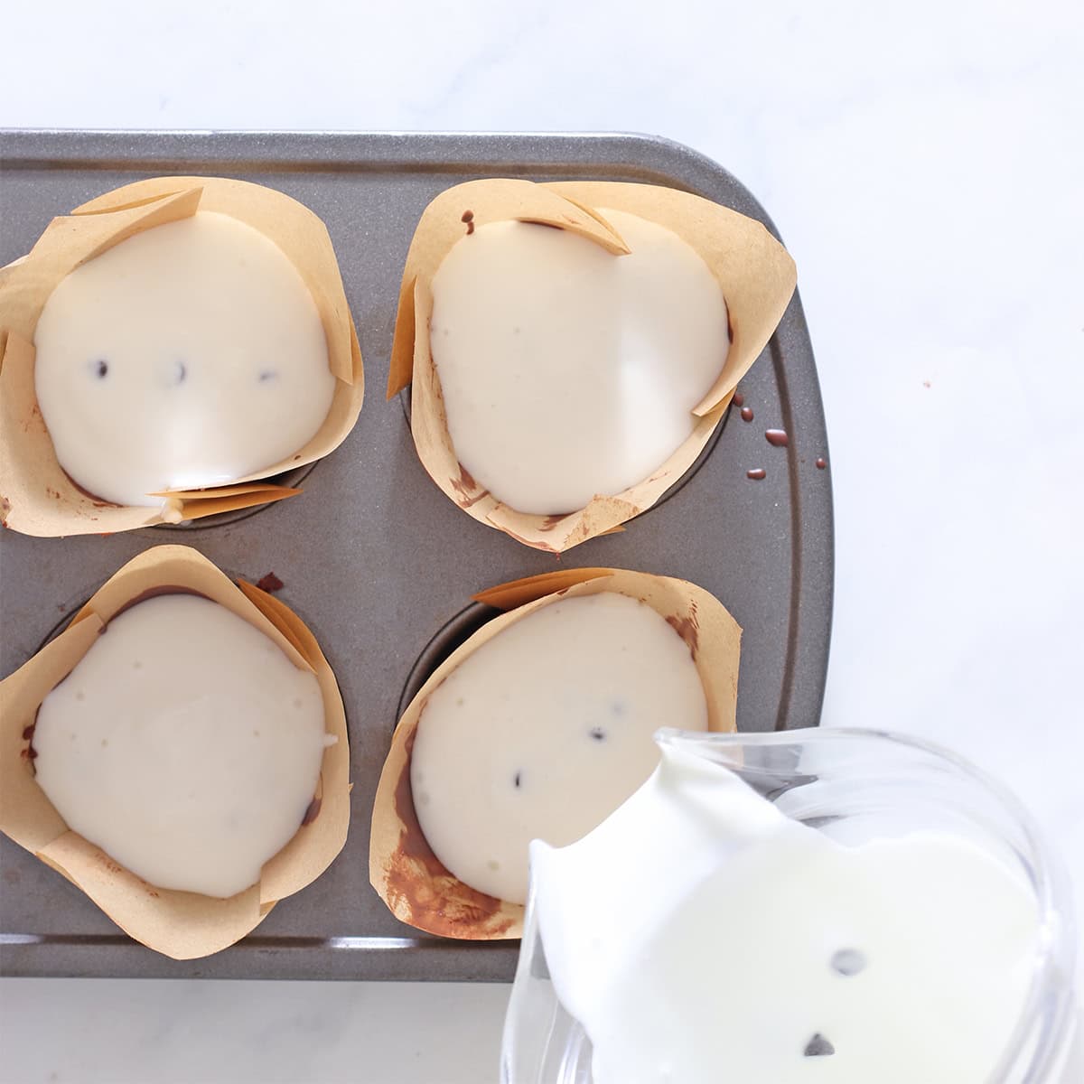 pour chocolate chip vanilla ice cream into cups.