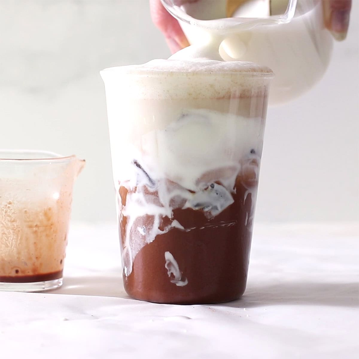 cloud coffee cocoa with foam being spoon.