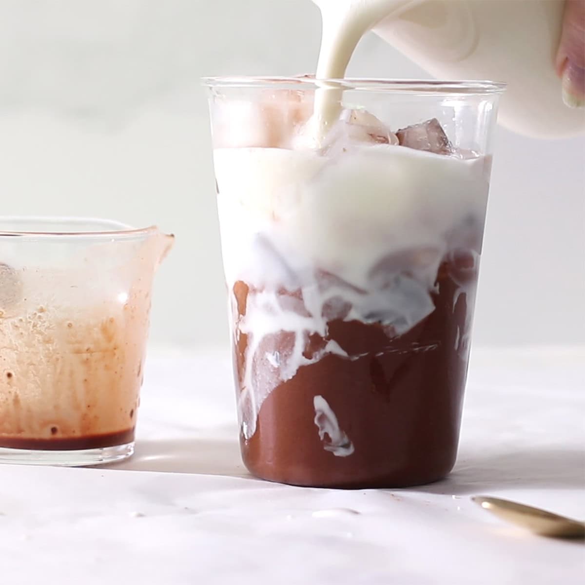 foamed milk poured into cloud coffee cocoa.