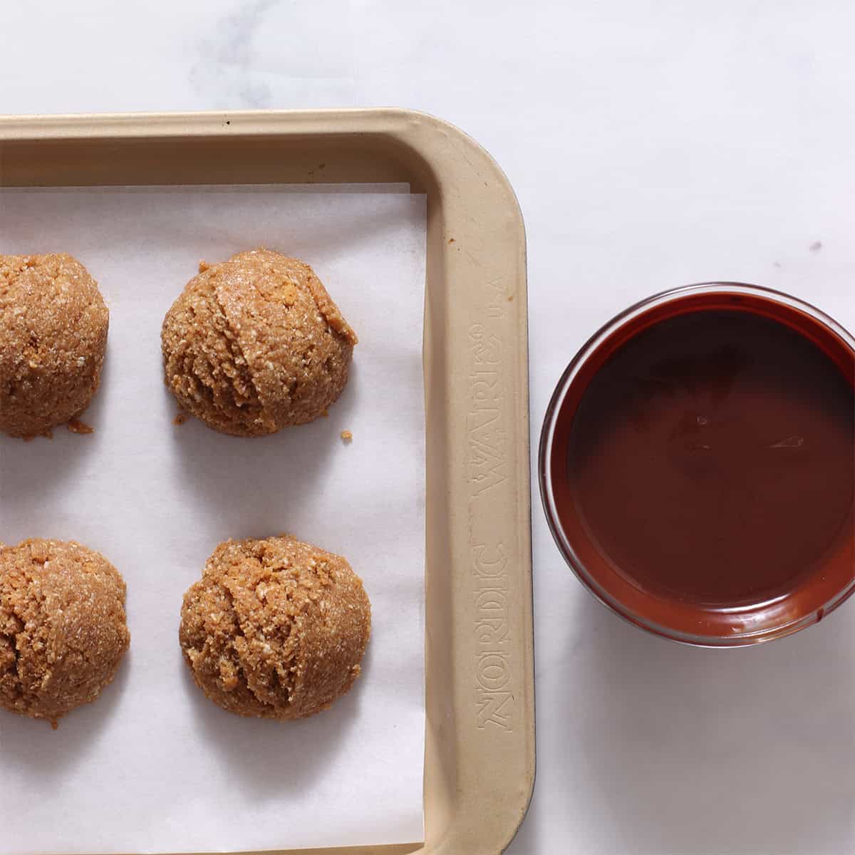 biscoff brownie balls with melted chocolate.